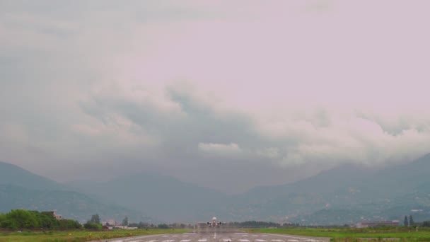 Ordinary White Commercial Jet Airliner Insignia Takes Runway Flies Mountains — Video