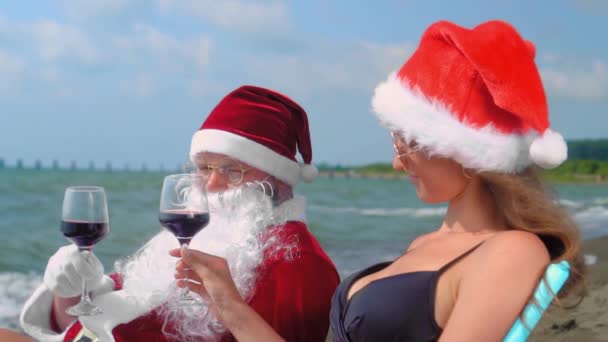 Christmas Santa Claus Relaxing Chaise Longue Sexy Woman Santa Hat — Stockvideo