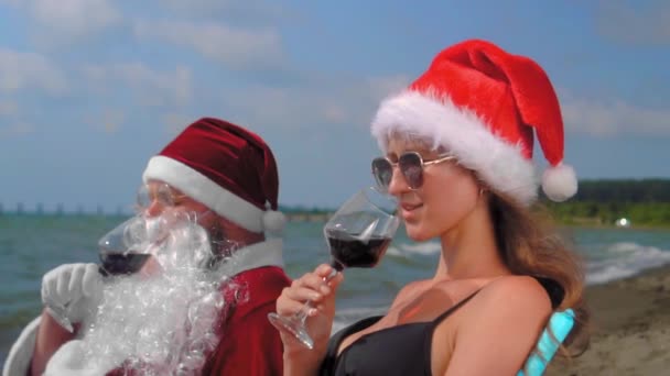 Christmas Santa Claus Relaxing Chaise Longue Sexy Woman Santa Hat — Vídeo de Stock