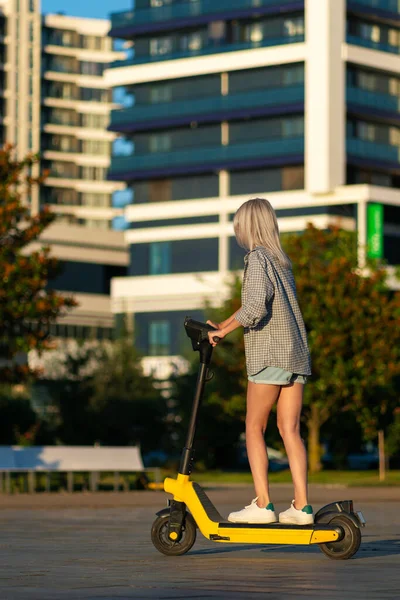 Young Beautiful Slender Woman Denim Shorts Shirt Riding Electric Scooter — Zdjęcie stockowe