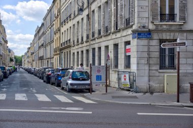 Versailles, France - May 28, 2022: Typical French street with old residential buildings in poor decorative order and some motion blurring