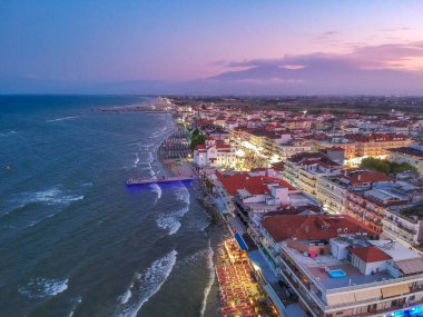 Aerial panorama view over the coastal town of Paralia Katerini, Greece at sunset. Located about 8 Km from the city of Katerini in Pieria, central Macedonia, Greece, Europe. clipart