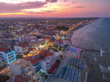 Aerial panorama view over the coastal town of Paralia Katerini, Greece at sunset. Located about 8 Km from the city of Katerini in Pieria, central Macedonia, Greece, Europe. clipart