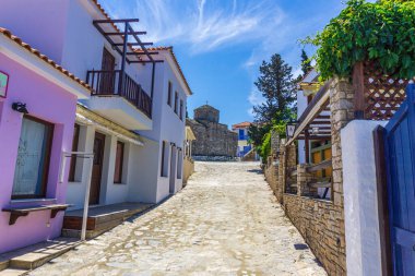 Beautiful scenery from the old village Chora, Alonissos island Greece. Traditional architectural buildings with narrow cobblestone paths and colorful houses.