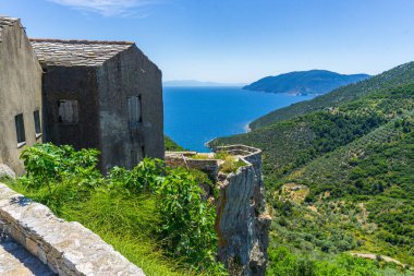 Beautiful scenery from the old village Chora, Alonissos island Greece. Traditional architectural buildings with narrow cobblestone paths and colorful houses.