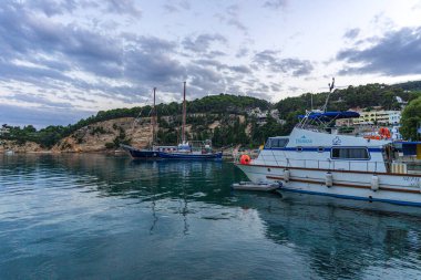 Traditional fishing boats at the picturesque port of Patitiri in Alonnisos island, Sporades, Greece, Mediterranean sea