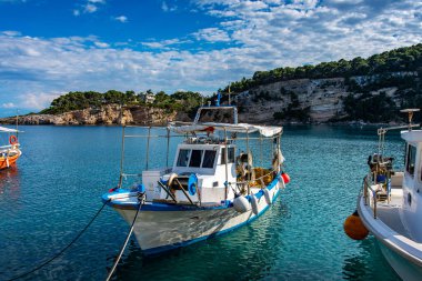 Traditional fishing boats at the picturesque port of Patitiri in Alonnisos island, Sporades, Greece, Mediterranean sea