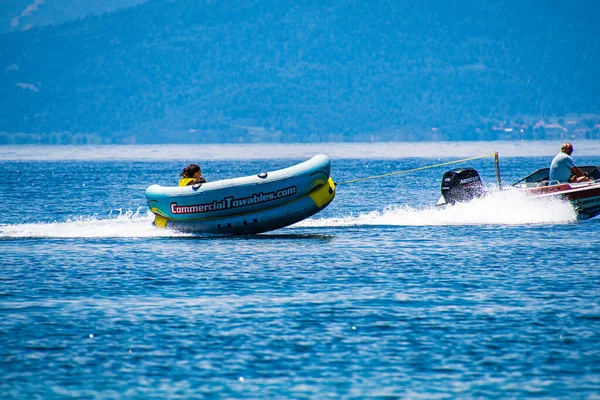 Tourists Enjoy Inflatable Towable Rides Koukounaries Beach Skiathos Island Sporades — Zdjęcie stockowe