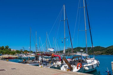 Beautiful seaside view with sailing boats and motorboats in Skiathos island, Sporades, Greece.