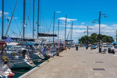 Beautiful seaside view with sailing boats and motorboats in Skiathos island, Sporades, Greece.