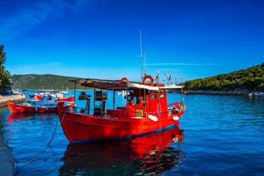 Traditional fishing boats at Steni Vala port the second most populous village on the Greek island of Alonnisos, a picturesque Greek island in Sporades, Aegean Sea, Greece