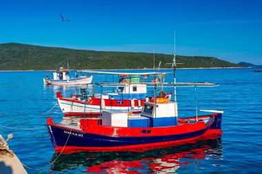 Traditional fishing boats at Steni Vala port the second most populous village on the Greek island of Alonnisos, a picturesque Greek island in Sporades, Aegean Sea, Greece
