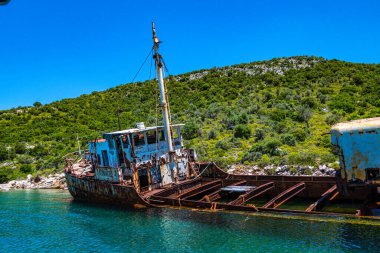 Seaside view over rusty shipwreck of an old cargo ship at Peristera island near Alonissos, Sporades, Greece