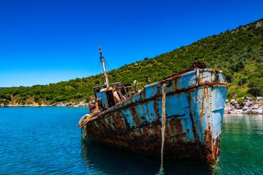 Seaside view over rusty shipwreck of an old cargo ship at Peristera island near Alonissos, Sporades, Greece