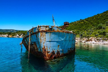 Seaside view over rusty shipwreck of an old cargo ship at Peristera island near Alonissos, Sporades, Greece