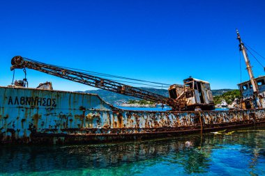 Seaside view over rusty shipwreck of an old cargo ship at Peristera island near Alonissos, Sporades, Greece