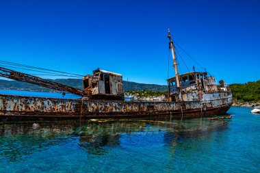 Seaside view over rusty shipwreck of an old cargo ship at Peristera island near Alonissos, Sporades, Greece