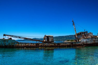 Seaside view over rusty shipwreck of an old cargo ship at Peristera island near Alonissos, Sporades, Greece
