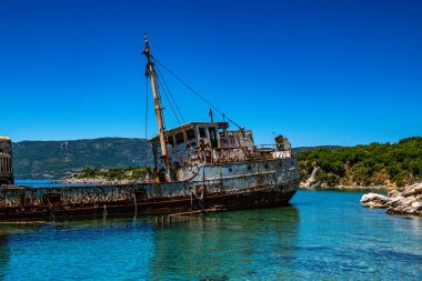 Seaside view over rusty shipwreck of an old cargo ship at Peristera island near Alonissos, Sporades, Greece