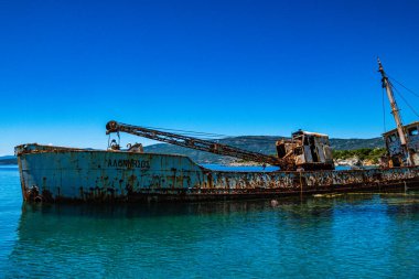 Seaside view over rusty shipwreck of an old cargo ship at Peristera island near Alonissos, Sporades, Greece