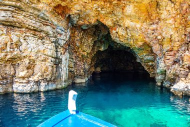 The famous caves of Votsi beach area in eastern Alonissos as seen during boating in Alonissos island, Sporades, Greece