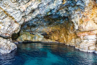 The famous caves of Votsi beach area in eastern Alonissos as seen during boating in Alonissos island, Sporades, Greece