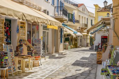 Urban view of Tinos island with narrow cobbled Streets and gift shops selling local products, souvenirs, Tinos, Cyclades Aegean Sea, Greece