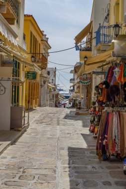 Urban view of Tinos island with narrow cobbled Streets and gift shops selling local products, souvenirs, Tinos, Cyclades Aegean Sea, Greece
