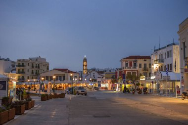 Urban view of Chora town in Tinos island around the port of Tinos in Cyclades, Greece, Europe