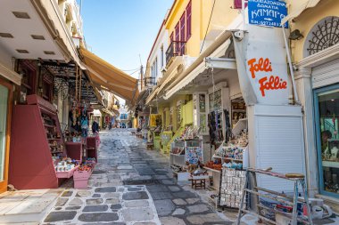 Urban view of Tinos island with narrow cobbled Streets and gift shops selling local products, souvenirs, Tinos, Cyclades Aegean Sea, Greece