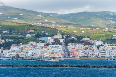 Beautiful view of the island of Tinos from the deck of a ferry boat in Sporades, Greece, Europe.
