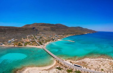Aerial view over Diakofti town during a hot Summer day in Kythera island, Greece, Europe