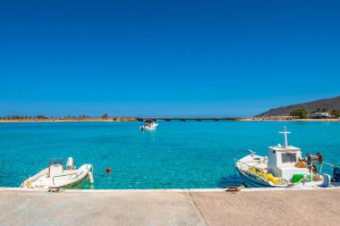 Traditional wooden fishing boats in Diakofti harbor in Kythira island, Greece, Europe