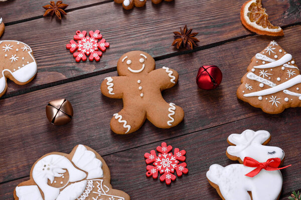 Christmas festive ginger gingerbread made at home on a dark table. Preparations for the New Year and Christmas