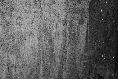 Çatlakları ve çizikleri olan metal bir duvarın dokusu arka plan olarak kullanılabilir.
