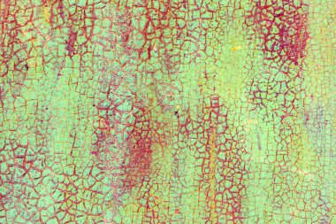 Çatlakları ve çizikleri olan metal bir duvarın dokusu arka plan olarak kullanılabilir.