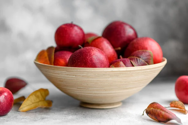 Beautiful Fresh Red Apples Autumn Leaves Wooden Vase Light Concrete — Stock Photo, Image