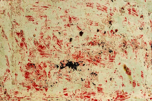 Çatlakları ve çizikleri olan metal bir duvarın dokusu arka plan olarak kullanılabilir.