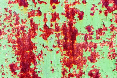 Çatlakları ve çizikleri olan metal bir duvarın dokusu arka plan olarak kullanılabilir.