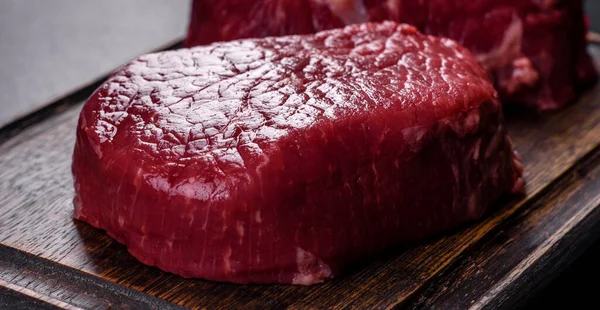 Raw Beef Steaks Cutting Board Spices Stone Background — Φωτογραφία Αρχείου