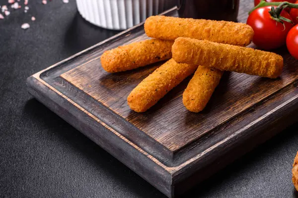 stock image Fried crispy nutritious cheese or potato sticks. Snacks for beer