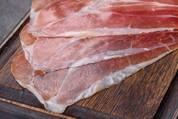 Italian Prosciutto Crudo Spanish Jamon Dark Cutting Board Salt Spices — Stockfoto