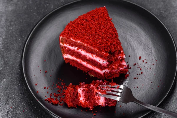 Red velvet cake, classic three layered cake from red butter sponge cakes with cream cheese frosting, American cuisine