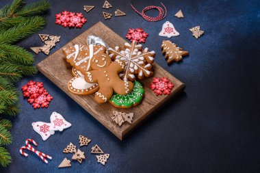 Christmas Decorations with Gingerbread man,fir tree branches and christmas background