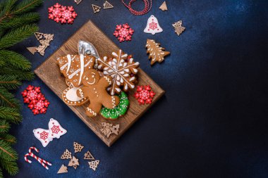 Christmas Decorations with Gingerbread man,fir tree branches and christmas background
