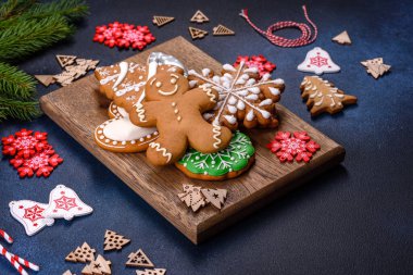Christmas Decorations with Gingerbread man,fir tree branches and christmas background