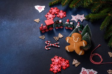 Christmas Decorations with Gingerbread man,fir tree branches and christmas background