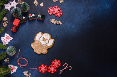 Christmas Decorations with Gingerbread man,fir tree branches and christmas background