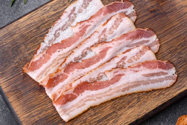 Raw Smoked Bacon Wooden Board Several Cut Pieces — Stockfoto