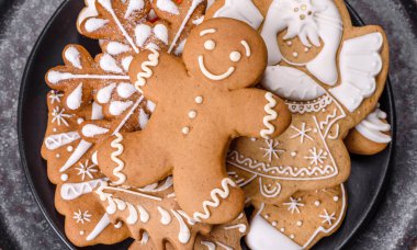 Gingerbread, Christmas tree decorations, dried citrus fruits on a gray concrete background to prepare a festive Christmas table